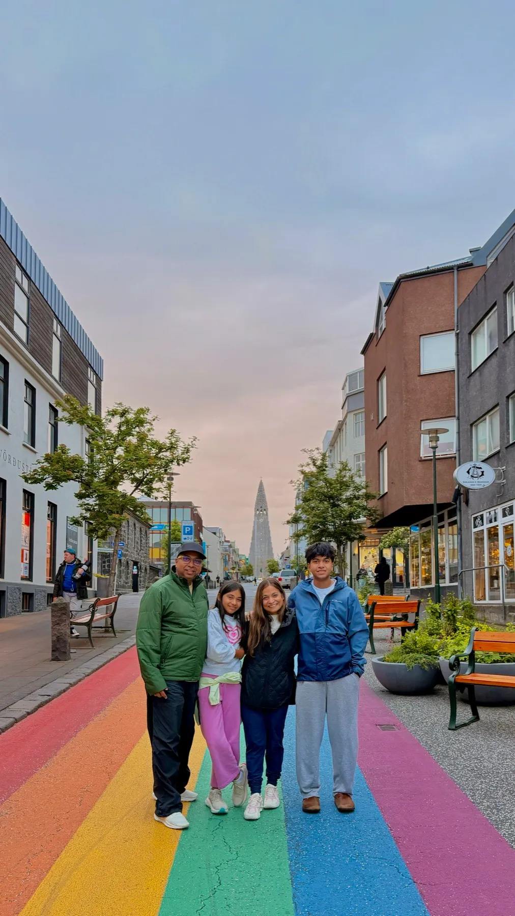 Anurag, Pinky, Aryaman and Ahana on Rainbow Street in Reykjavík, with Hallgrímskirkja behind them