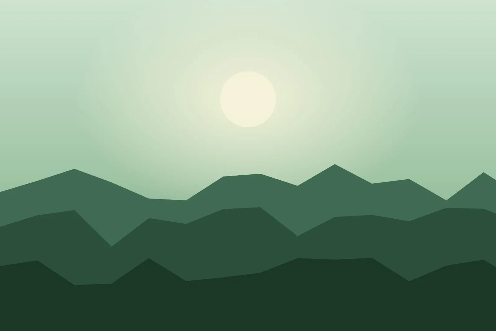Green forested valley under soft morning haze